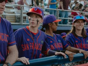 San Francisco Firebells coach Matt Williams (from left), second baseman Amanda Gianelloni, catcher Samantha Gutierrez and left fielder Skylar Kaplan in the dugout prior to their game on Sunday, Aug. 2.