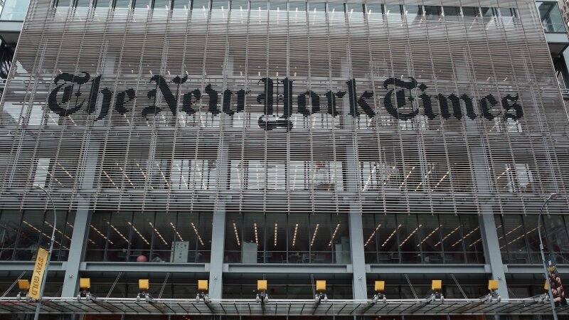 The New York Times says federal agents showed up at several of its journalists' homes Friday night to try to force them to testify before a grand jury next week.