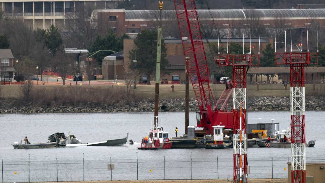 Rescue and salvage crews work near the wreckage of an American Airlines jet in the Potomac River near Ronald Reagan Washington National Airport on Sunday, Feb. 2, 2025, in Arlington, Va.