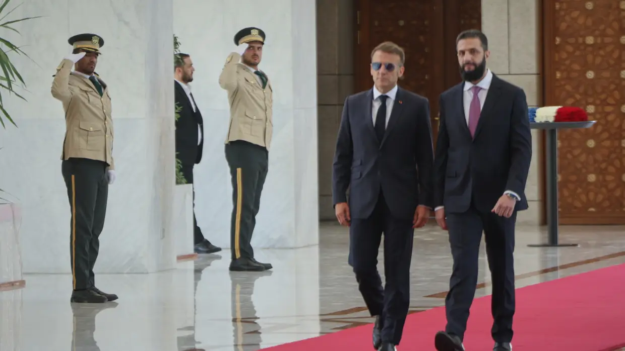 Explosions rock Damascus, wounding 18, as French President Macron visits Syria
