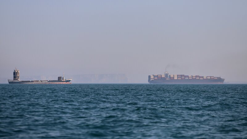 A container ship and a cargo vessel are seen in the Strait of Hormuz off Bandar Abbas, Iran, on June 17.