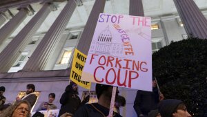 People protest during a rally against Elon Musk outside the Treasury Department in Washington, D.C., on Tuesday, Feb. 4, 2025.