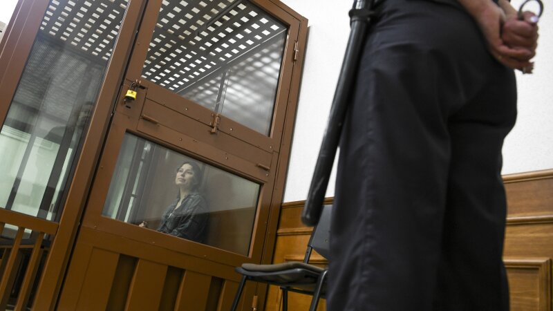 Ksenia Karelina, also known by the last name of Khavana, sits in a defendant’s cage in a court in Yekaterinburg, Russia, on June 20, 2024. The dual Russian-U.S. citizen was arrested on treason charges in Yekaterinburg in February after returning from Los Angeles to visit relatives. The charges reportedly stem from her $51 donation to a U.S. charity that helps Ukraine.
