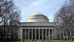 Students walk past the "Great Dome" on the Massachusetts Institute of Technology campus in Cambridge on April 3, 2017. 