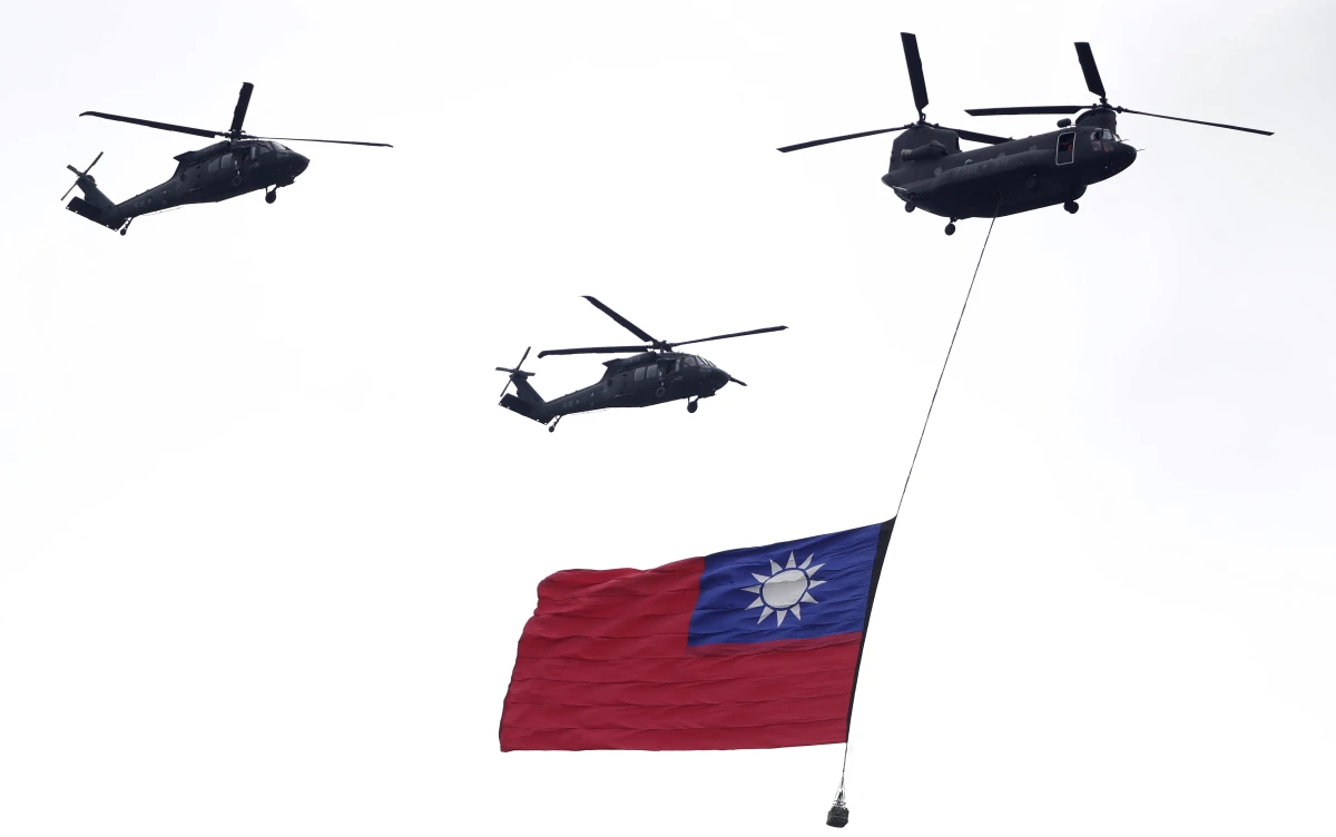 Helicopters fly over with Taiwan national flag during an inauguration celebration of Taiwan's President Lai Ching-te in Taipei, Taiwan, on May 20, 2024.