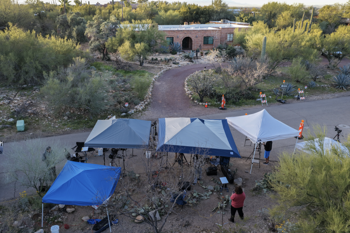 News crews are stationed across the street from Nancy Guthrie's home in Tucson, Ariz., on Feb. 25. Experts on missing person cases acknowledge that some families may want to avoid media attention — but, they say, the exposure raises the chances that a person is found.