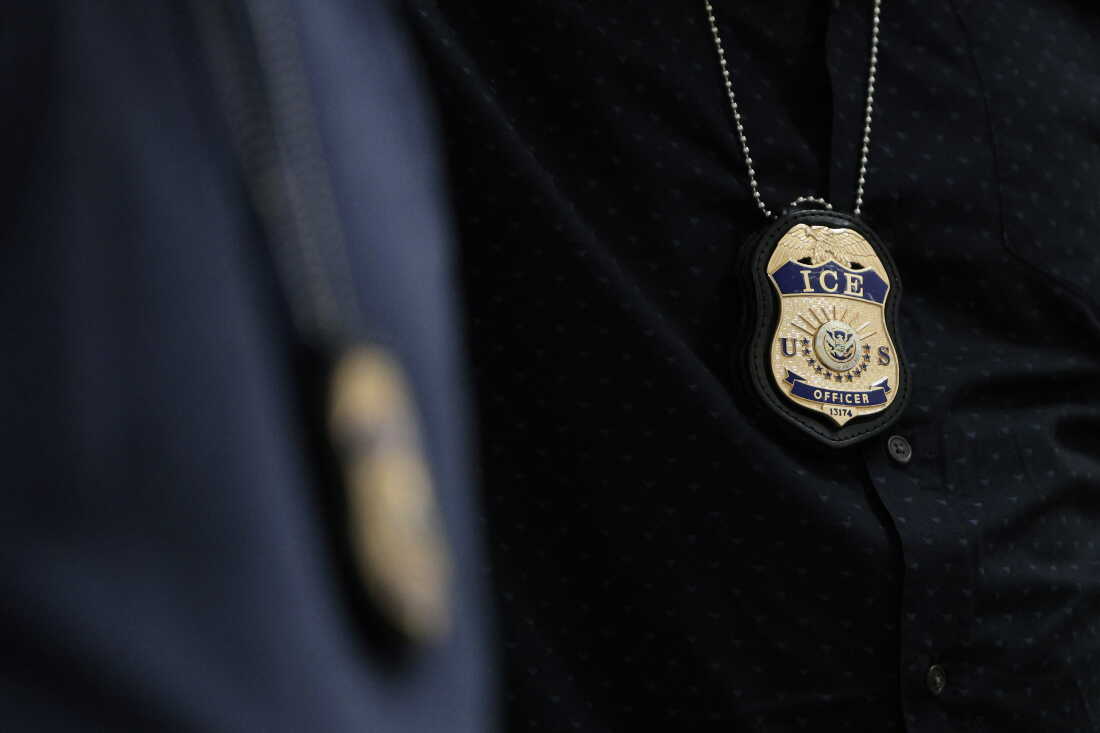 The badges of Immigration and Customs Enforcement (ICE) agents are seen as they patrol the halls of immigration court at the Ted Weiss Federal Building in New York City.