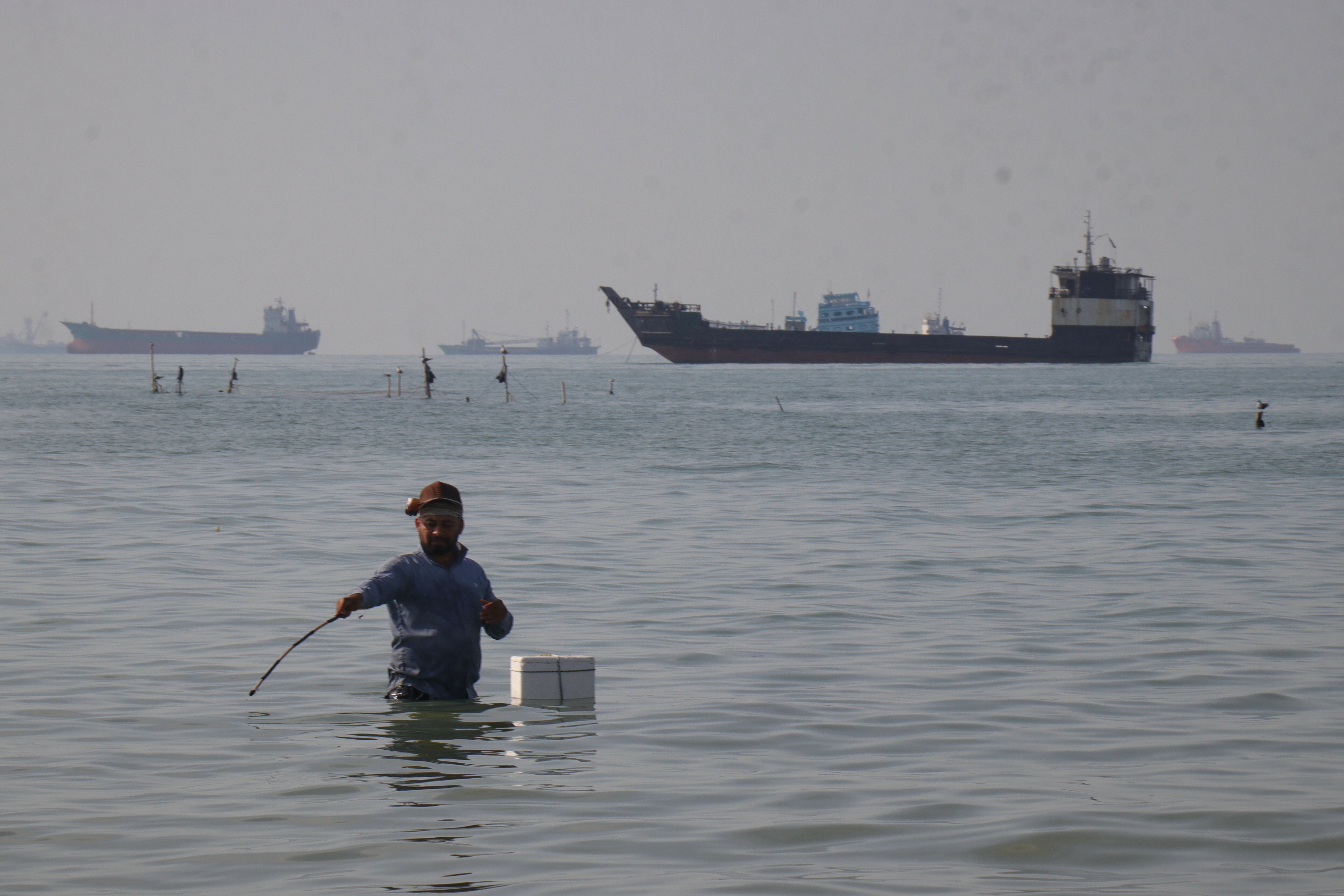 Trump says the U.S will 'guide' stranded ships from the Strait of Hormuz