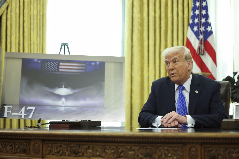 President Trump speaks as an image of an F-47 fighter jet is displayed in the Oval Office in Washington on Friday. (AP)
