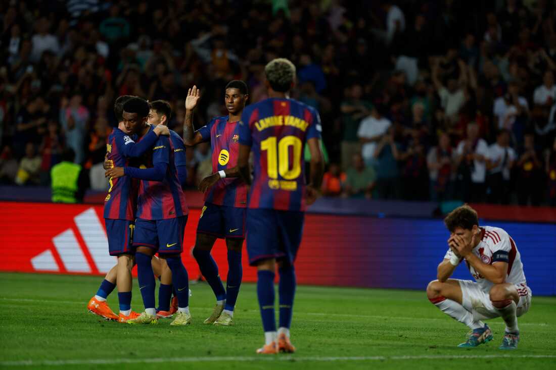 Barcelona's players celebrate the sixth goal of their team during the Champions League opening phase soccer match between Barcelona and Olympiacos in Barcelona, Spain, on Tuesday.