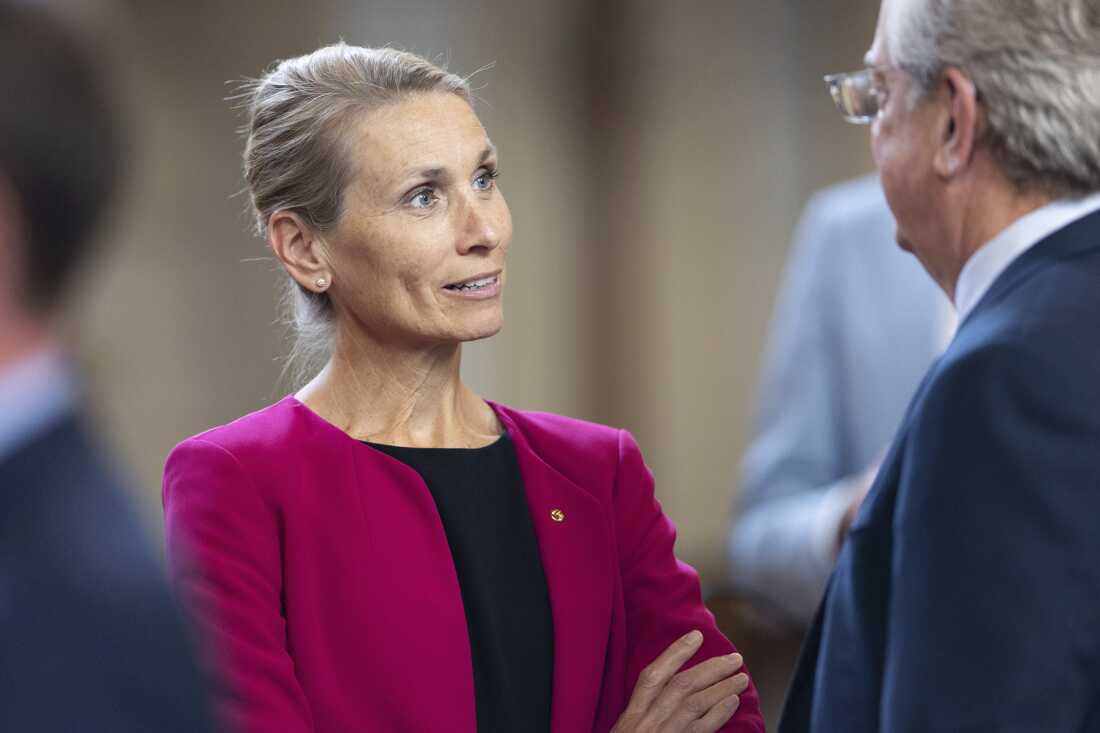 State Sen. Christy Armendariz chats with a colleague on the legislative floor of the Nebraska State Capitol in 2024, in Lincoln, Neb.
