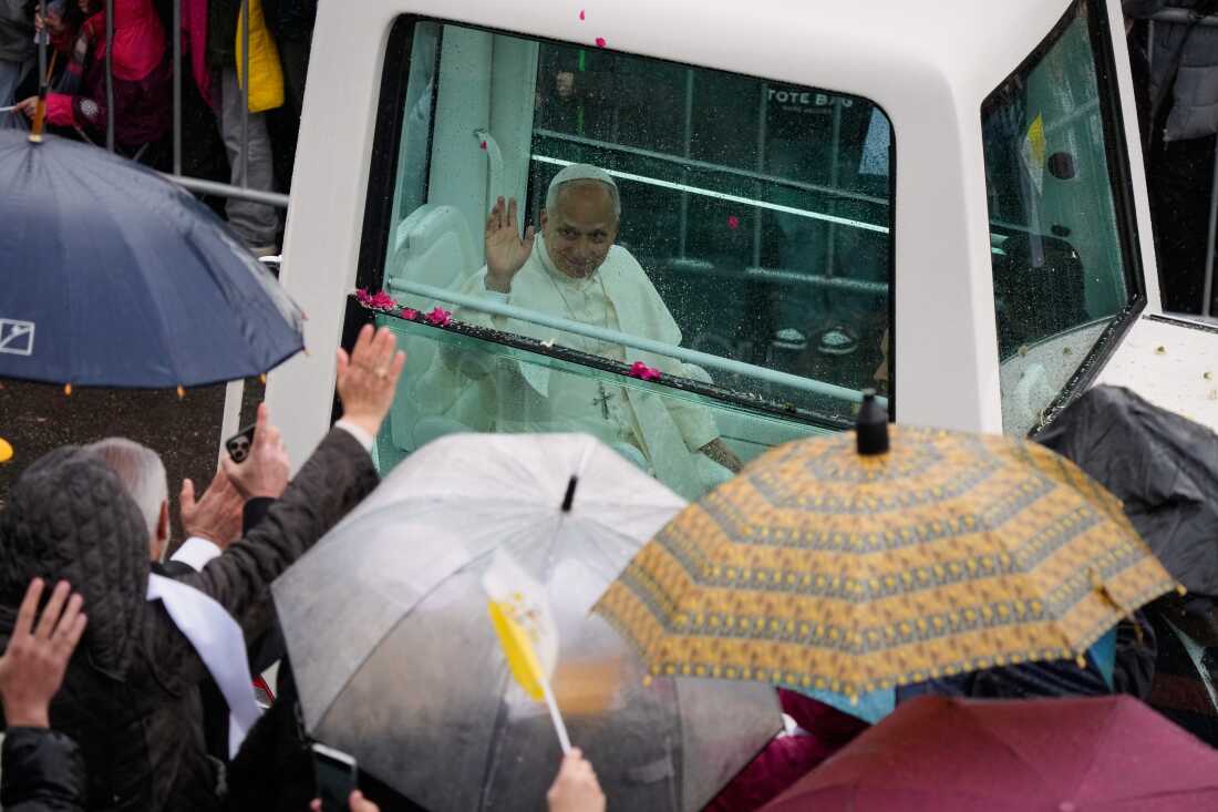 Pope Leo XIV waves from the popemobile as he arrives to the Monastery of Saint Maroun in Annaya, Lebanon, Monday, Dec. 1, 2025.