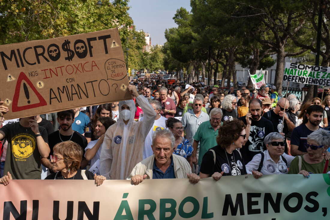 ZARAGOZA, SPAIN - SEPTEMBER 27, 2026 Hundreds of demonstratos walk through the streets during a protest against data centers in Zaragoza, Spain on September 27, 2026. The Spanish region of Aragon is seeing a huge surge in data center construction which has alarmed many local residents due to their high energy use, noise pollution and heat generation. Microsoft and Amazon are currently building massive data centers just outside of Spain’s fourth largest city. Activists and protesters say that the arid region of Spain does not have the water to spare for the thirsty infrastructure. Amazon alone is building 30 data center buildings, according to papers they filed with the regional government. (Photo by Michael Robinson Chávez for National Public Radio)