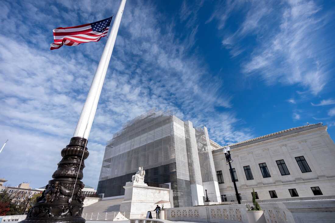 An American flag is seen outside the Supreme Court, in Washington, D.C., in November. This week, the high court will hear oral arguments for a case that could change who gets to be a U.S. citizen.