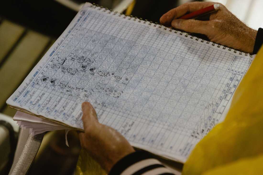 A fan's rain soaked scorecard on Opening Day of the Women's Pro Baseball League. Springfield, IL, August 1, 2026.