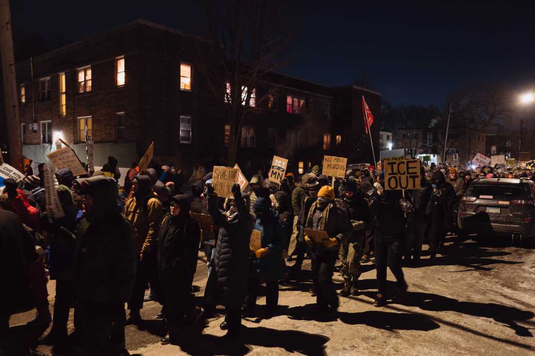 Minneapolis residents and protesters march through the streets during a vigil for Alex Pretti, who was fatally shot by a federal agent during an immigration enforcement operation. Jan. 24, 2026. Zaydee Sanchez for NPR