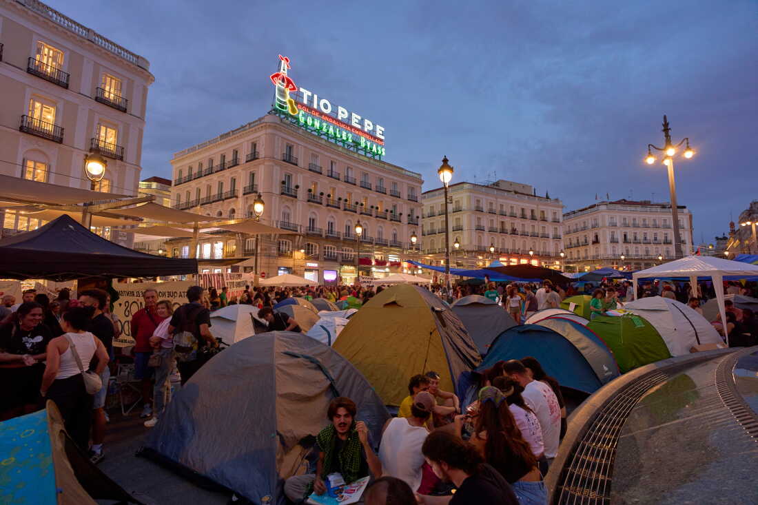 Protesters camp during a protest following the eviction last Wednesday of 87-year-old Maricarmen to demand stronger laws to protect renters at Sol square in Madrid, Spain, Sunday, Sept. 27, 2026.