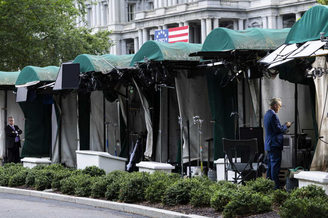 WASHINGTON, DC - SEPTEMBER 21: White House TV correspondents prepare to go live as the CNN booth is empty on the White House grounds on September 21, 2026 in Washington, DC. Reporters from MS NOW, CNN, and Politico have been blocked from accessing the White House since September 19th after President Trump said he was banning the three outlets from the property.