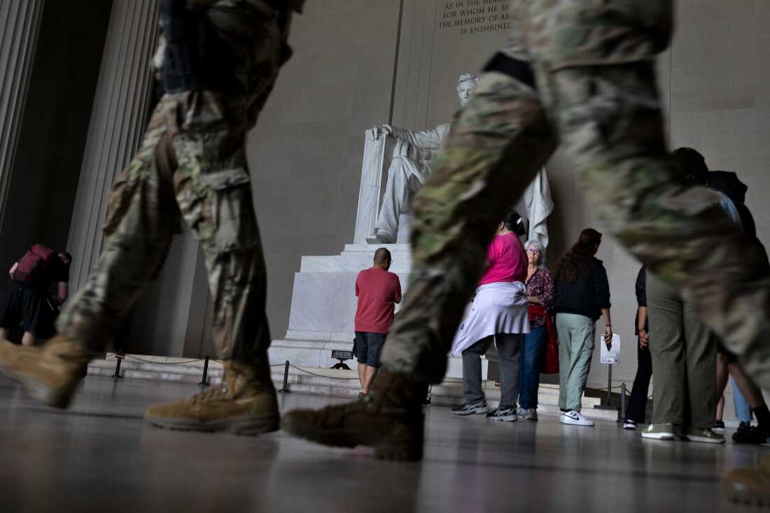 Members of the National Guard walk through the Lincoln Memorial while patrolling the National Mall on September 17, 2025, in Washington, D.C.