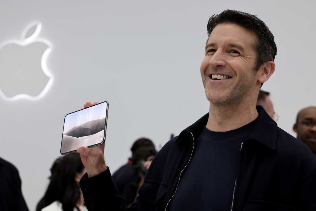 Apple CEO John Ternus holds the iPhone Duo during Apple’s “Surprise and Shine” event at the company's corporate headquarters, Apple Park, on September 9, 2026 i