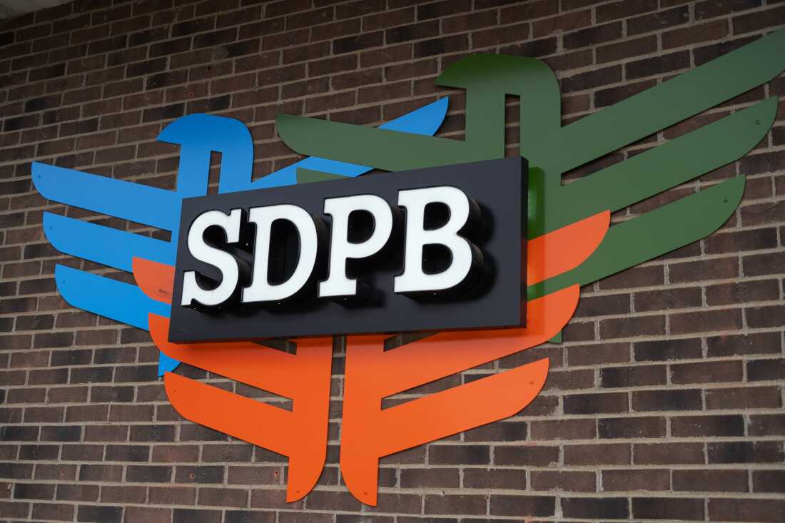 A sign for South Dakota Public Broadcasting hangs outside its office in Sioux Falls.