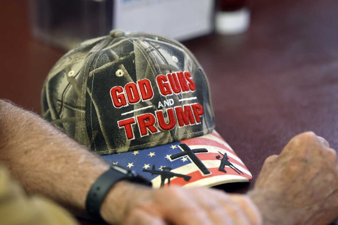 A detailed view of a hat that reads, God Guns and Trump is seen at a campaign event for U.S. Rep. Julia Letlow, a Republican from Louisiana, at Bourne's Restaurant on May 6, 2026 in Franklinton, La. Gun rights groups see ‘golden age’ under the Trump administration’s second term.