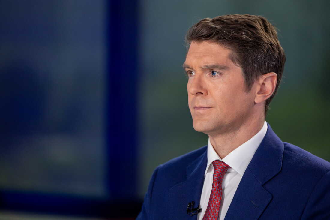 Benjamin Hall is wearing a blue suit and red patterned tie as he hosts "Fox News Sunday" on May 12, 2024.
