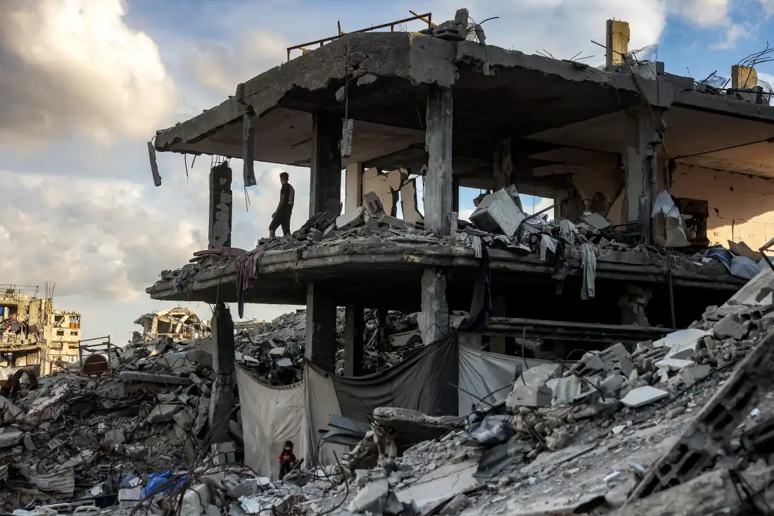 A man stands in a destroyed building in the Jabalia camp for Palestinian refugees in the northern Gaza Strip on October 20, 2026.