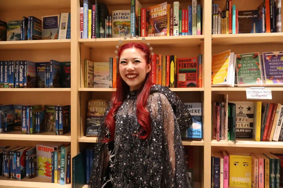Ivana Wong's black dress adorned with sequinned stars, a silver headpiece and a sheer, flowing cape won the evening's costume competition.