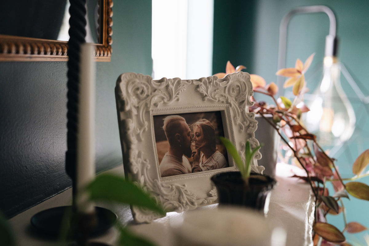 A framed photo of Ben and Sarah Brewington sits on the mantle. They both agreed that parenthood wasn't right for their future.