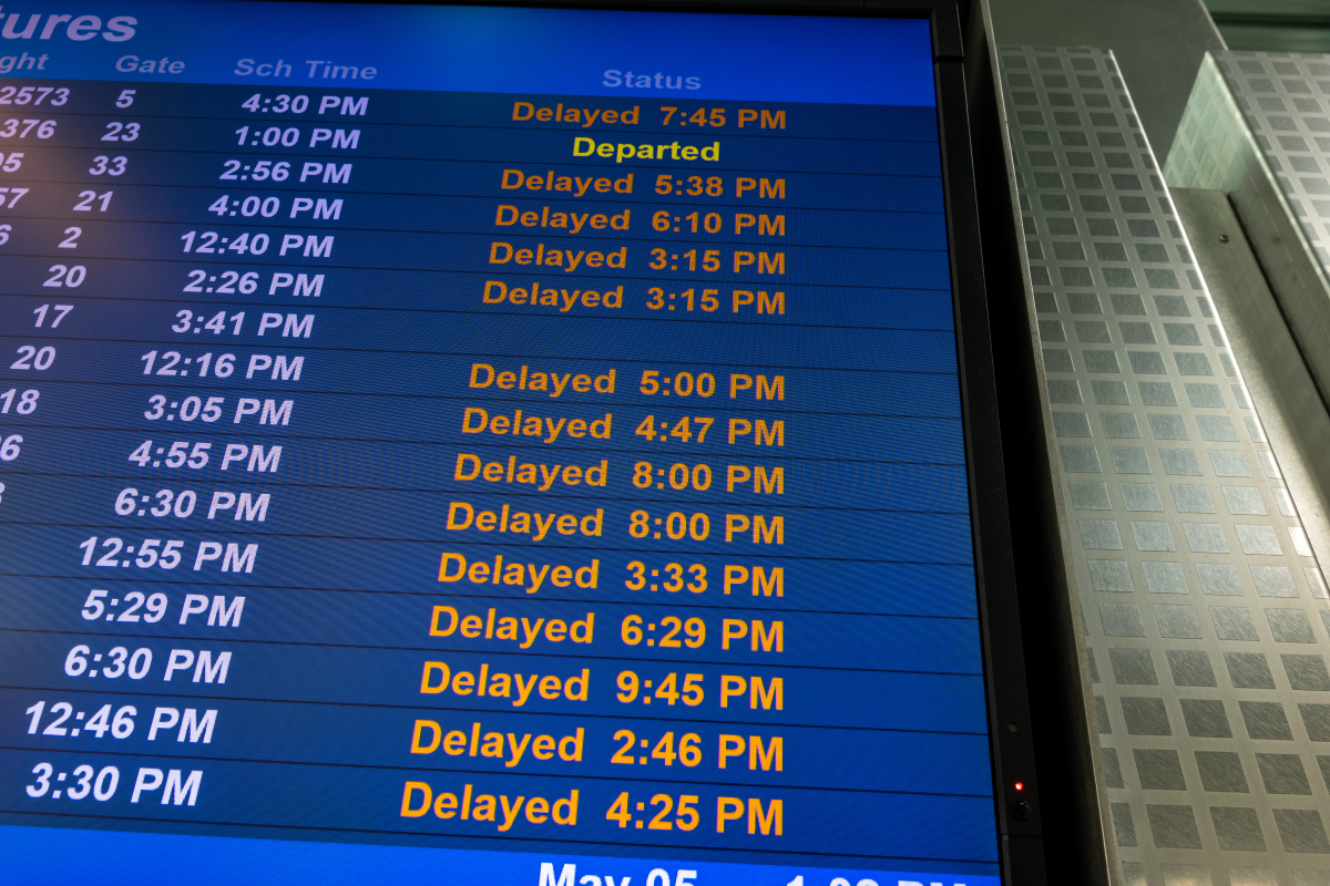 A monitor shows flight delays at Newark International Airport on May 05, 2025 in Newark, N.J. Delays and cancellations at one of the nation's busiest airports have persisted for weeks due to air traffic control outages, shortages of controllers and runway construction.