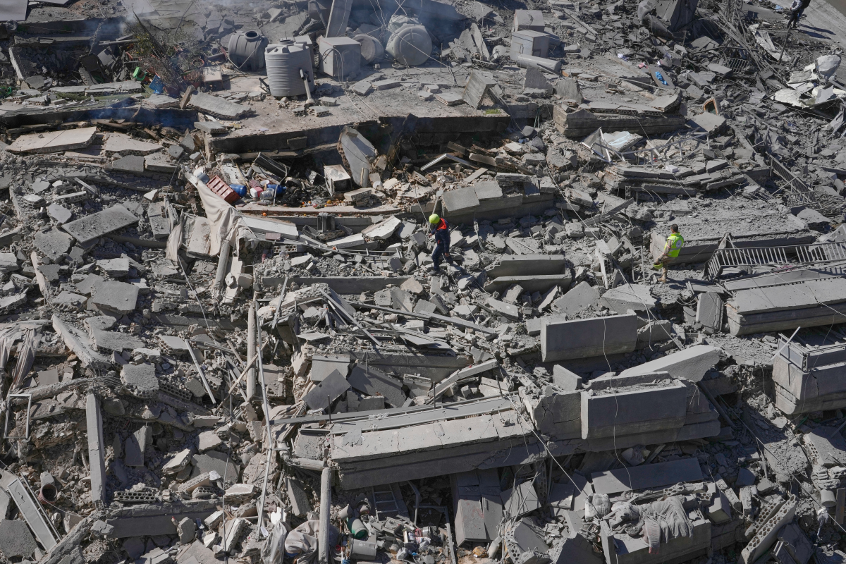 March 5: Rescue workers check a destroyed building that was hit by an Israeli airstrike in Nabatiyeh town, south Lebanon.