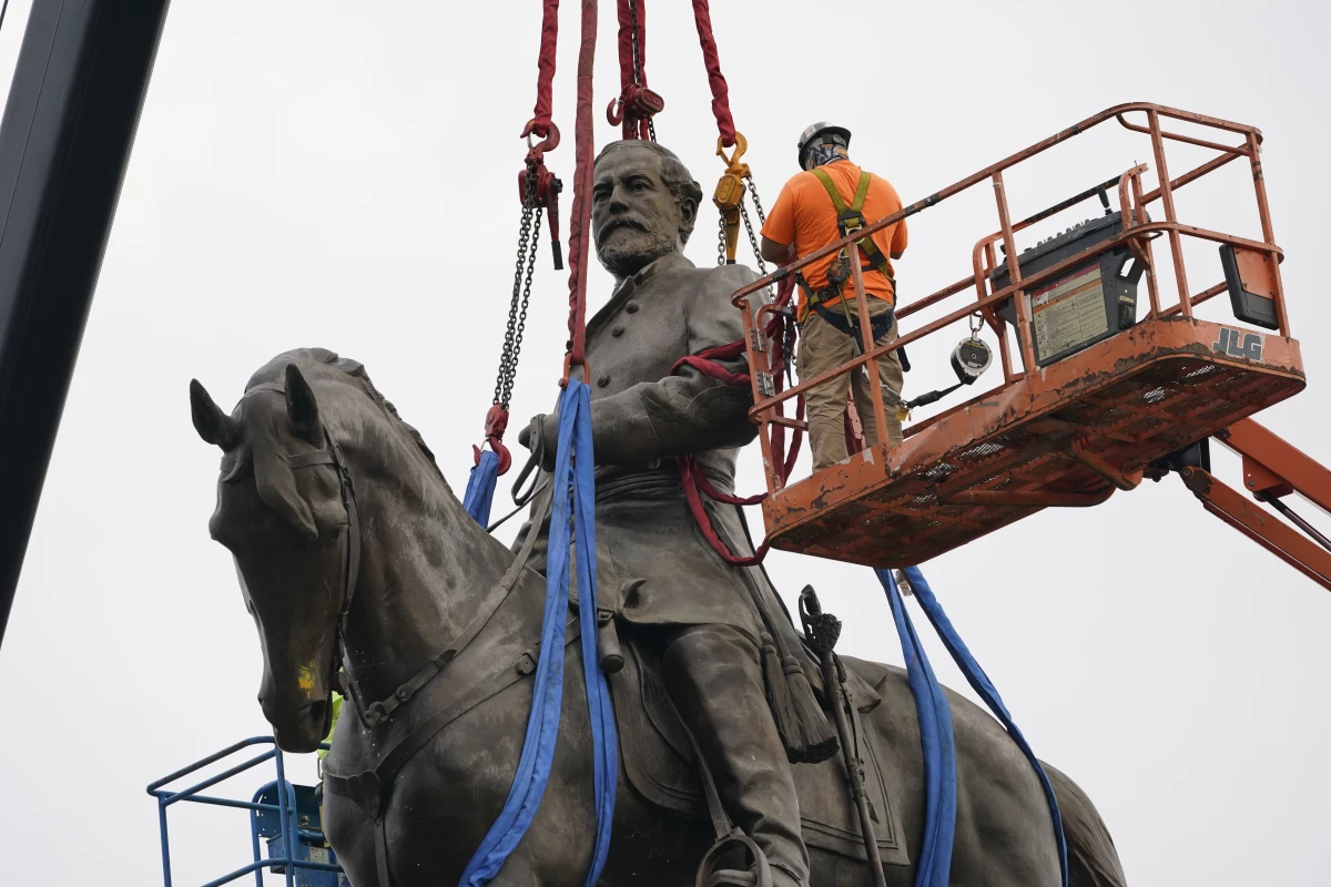A towering statue of Confederate General Robert E. Lee is removed in Richmond, Va., in September 2021. It was one of many monuments and statues to Confederate leaders removed or relocated following protests after George Floyd's murder in 2020.