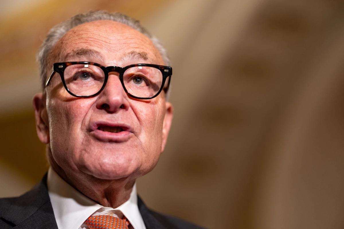 Senate Minority Leader Chuck Schumer, D-N.Y., speaks to the media following a Senate policy luncheon at the U.S. Capitol on Tuesday. Schumer is facing tremendous political pressure from grassroots activists to fight Republicans and the Trump administration.