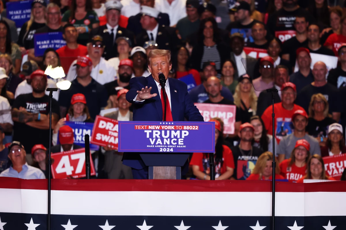 Former President Trump speaks during a campaign rally on Wednesday. Trump, who owns more than half of Truth Social's parent company, is now facing a decision over whether to start selling off his $2 billion stake.