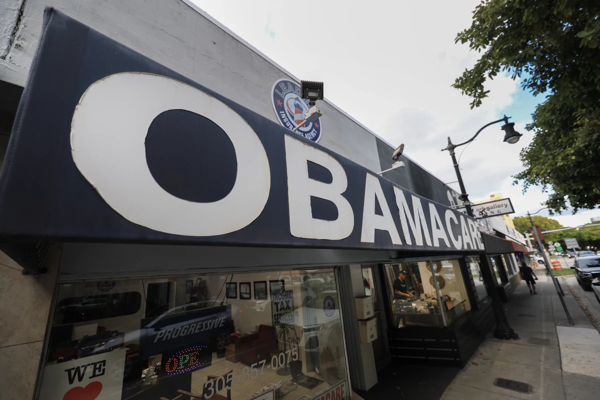 An Obamacare sign is displayed outside an insurance agency on Nov. 12, 2025 in Miami.