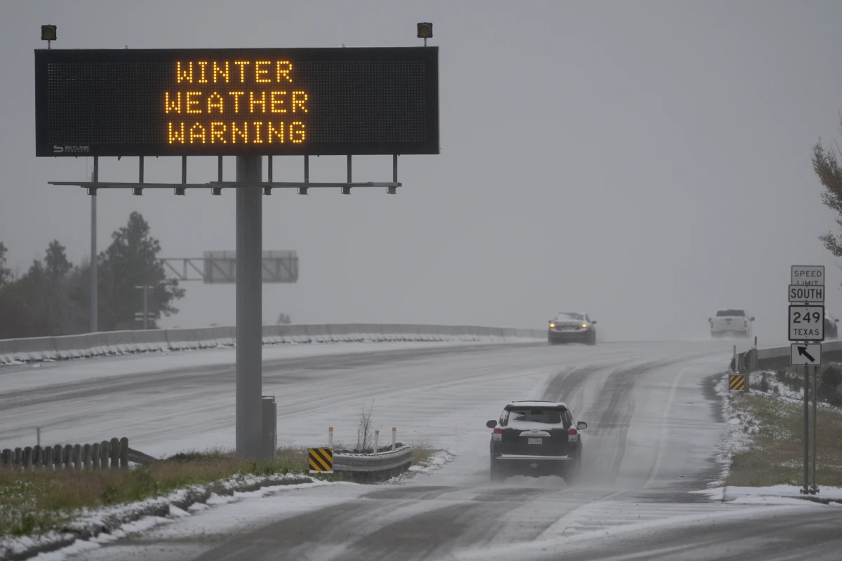 Houston, Texas: Cars travel on a snow covered highway Tuesday, Jan. 21.