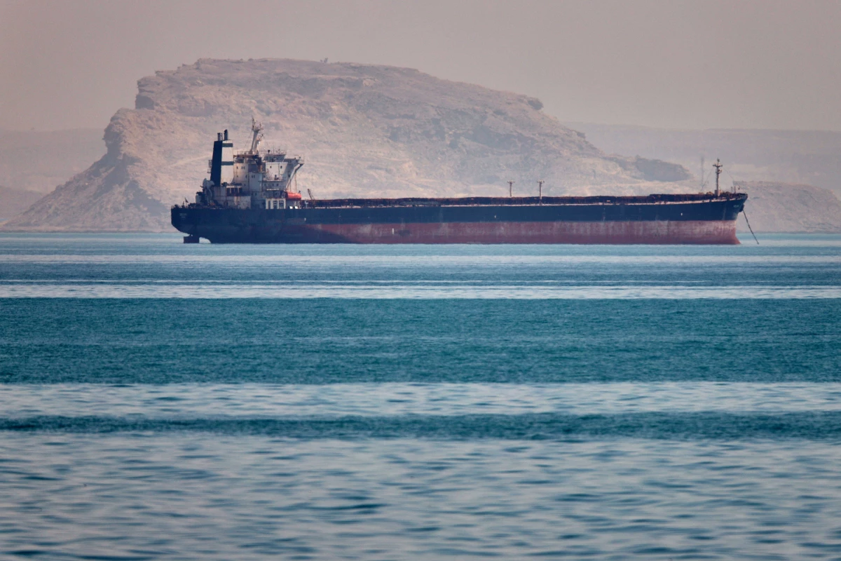 A bulk cargo ship sits at anchor in the Strait of Hormuz off Bandar Abbas, Iran, Saturday, May 2, 2026.