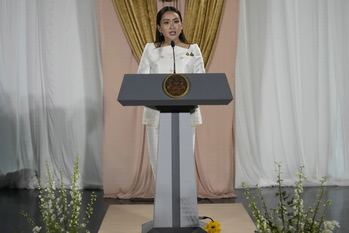 Thailand's new prime minister, Paetongtarn Shinawatra, talks to journalists after receiving a royal letter of endorsement for the post at the Pheu Thai party headquarters in Bangkok, Thailand, Aug. 18, 2024.