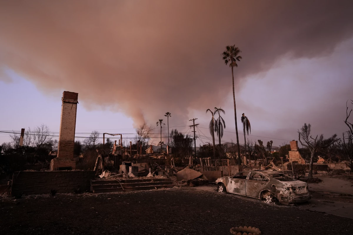 Flames from the Palisades Fire burn a building on Sunset Boulevard amid a powerful windstorm on January 8, 2025 in the Pacific Palisades neighborhood of Los Angeles, California.