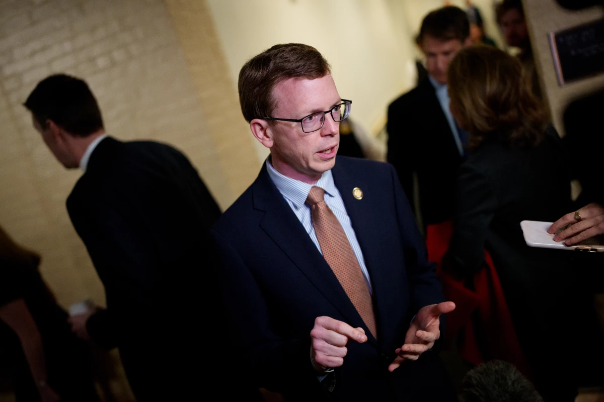 Rep. Dusty Johnson, R-S.D., speaks to a reporter after a House Republican caucus meeting at the U.S. Capitol on Feb. 25, 2025, in Washington.