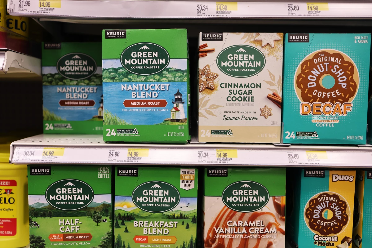 Boxes of Green Mountain Keurig coffee K-Cup pods are seen on display at a Target store. The Securities and Exchange Commission has announced that they are charging Keurig Dr Pepper over inaccurate claims made by the company about the recyclability of its disposable K-Cup pods.