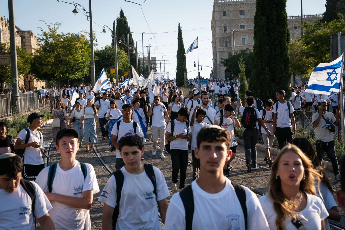 Tens of thousands of Israelis marched through the streets of Jerusalem Wednesday to mark Jerusalem Day. The march begins in west Jerusalem and travels through east Jerusalem and the Muslim Quarter of the Old City, ending at the Western Wall. The march marks the anniversary of the Six-Day War in 1967, when Israel annexed East Jerusalem, including the Western Wall.
