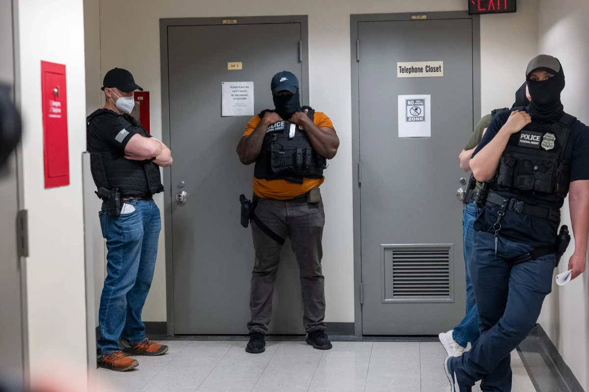Federal agents patrol the halls of immigration court at the Jacob K. Javitz Federal Building in June 2025 in New York City.