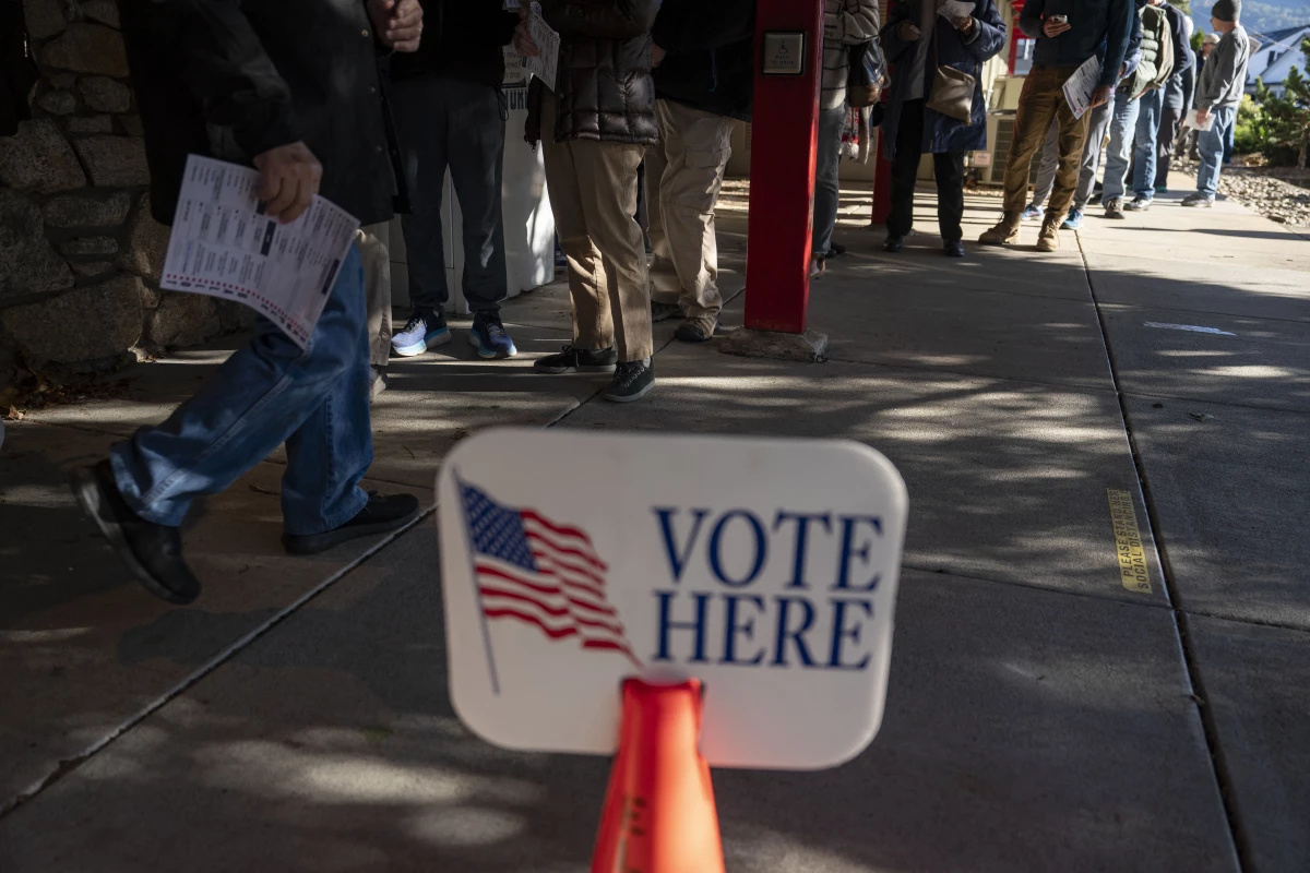 People wait in line to cast ballots during early voting at a polling station in Black Mountain, North Carolina, on Friday.