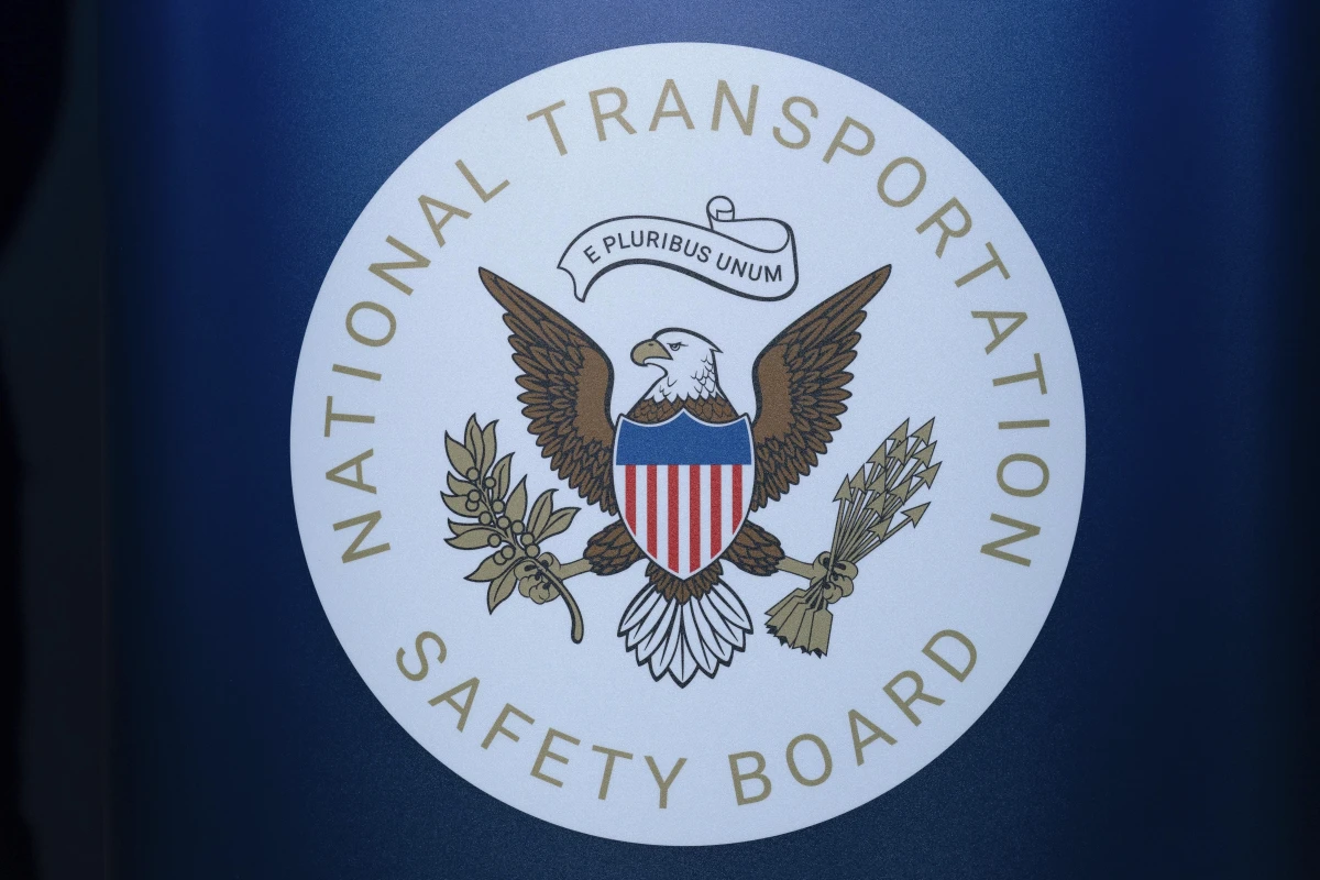 The seal of the National Transportation Safety Board is seen before a news conference at Ronald Reagan Washington National Airport on Jan. 31. The pilot of a small plane that crashed near a North Carolina airport this month had raised a wheel after landing to avoid hitting a turtle on the runway, according to a preliminary report by the NTSB.