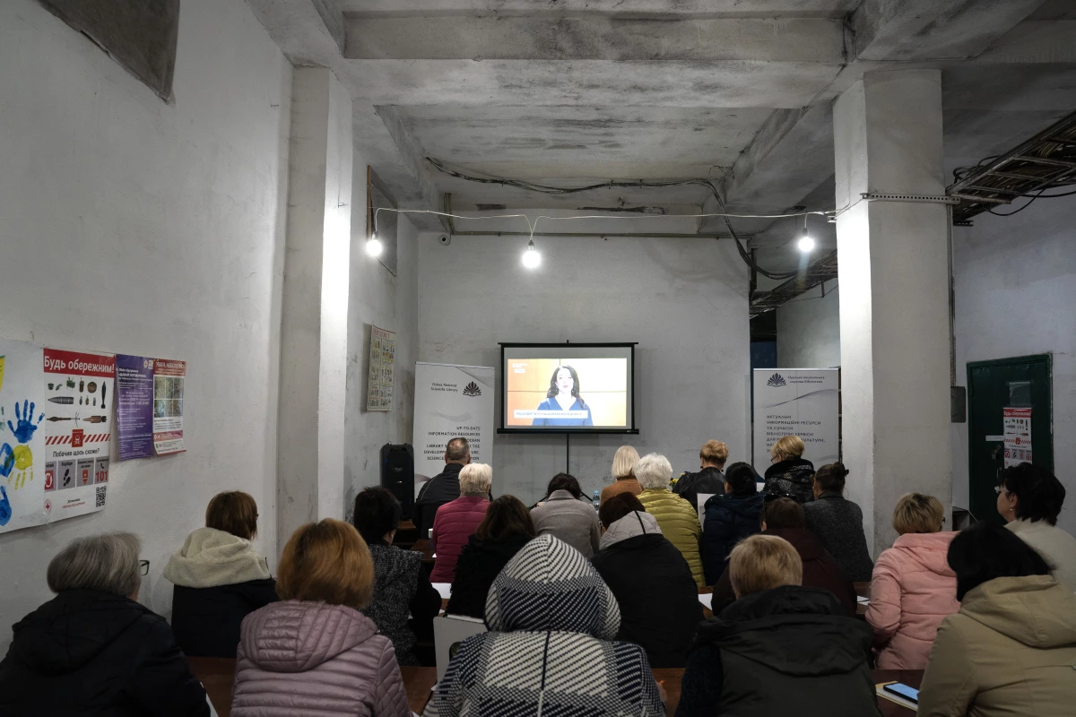 Ukrainians are gathered to write down every word they hear during an annual national dictation event, in a bomb shelter below the Odesa National Scientific Library in Odesa, Ukraine, on Oct. 28, 2024.