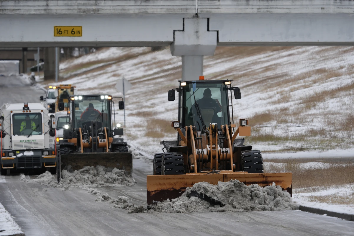 Houston, Texas: Workers plow snow off the roadways at the closed George Bush Intercontinental Airport on Jan. 21.
