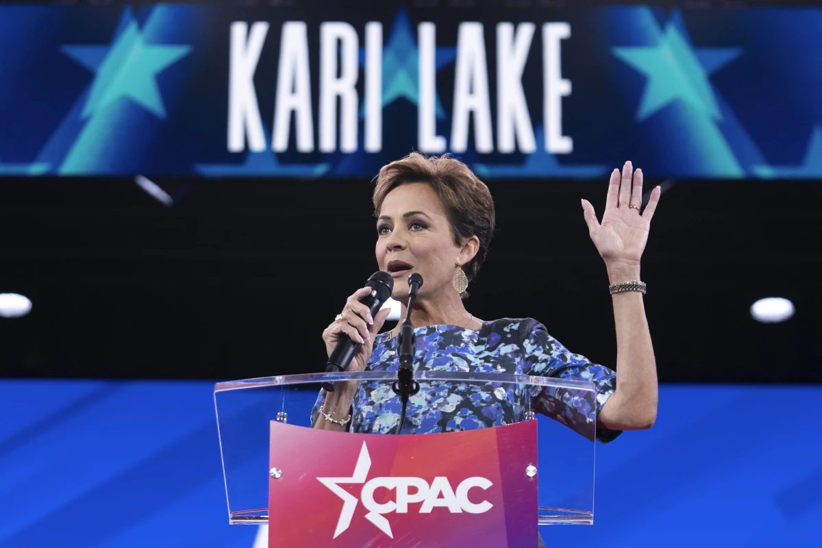 Senior Trump adviser Kari Lake, shown above at a conservative conference earlier this year, announced Tuesday night that Voice of America would rely on coverage from the far-right television network OAN. Voice of America employees that Lake put on indefinite leave are suing to be restored to their jobs.