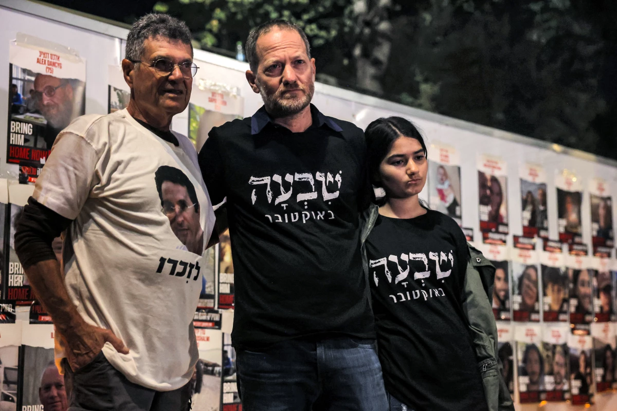 Maoz Inon (center), whose parents died in the Hamas-led attack of Oct. 7, 2023, stands alongside Yaakov Godo (left), 74, who lost his son in the attack, at a protest calling on the Israeli prime minister to resign and a vigil demanding government action for return of hostages outside the Israeli parliament in Jerusalem on Nov. 7, 2023.